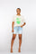 Geisha Fashion: Woman modeling shirt and shorts, white background. Text: Wish For Summer.
