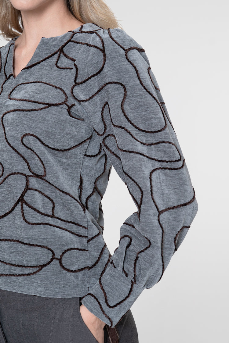 Geisha top met grafische lijnprint en V-snit